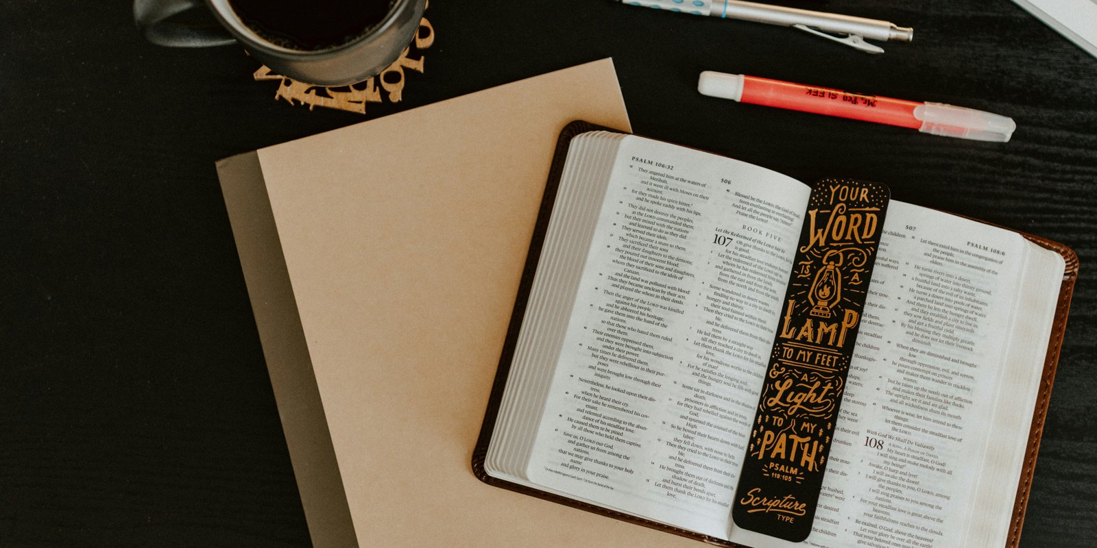 Bible, notebook, pen, coffee