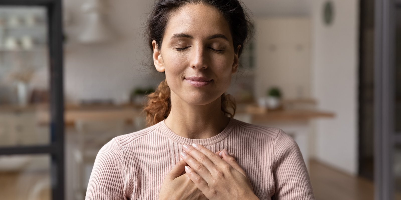 Woman in heartfelt posture